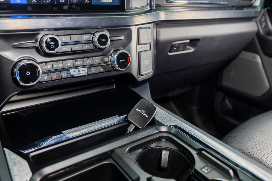 AutoLinkr adapter plugged into a car USB port, close-up